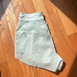 Sheer teal green lululemon four inch shorts
